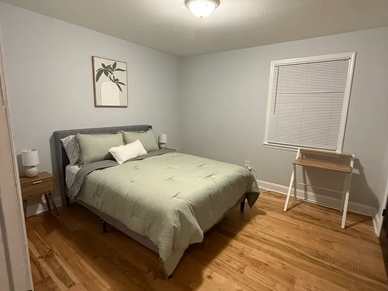 bedroom 2 queen bed wit desk and chair (not pictured) and large closet with storage
