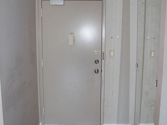 Entry door with coat closet