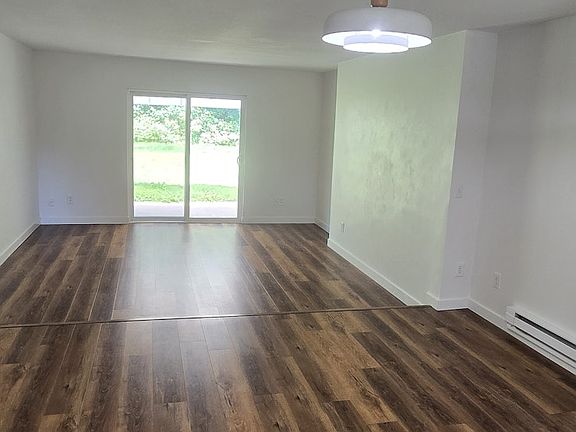 Open floor plan with large dining room and living room. Sliding glass door to back yard.