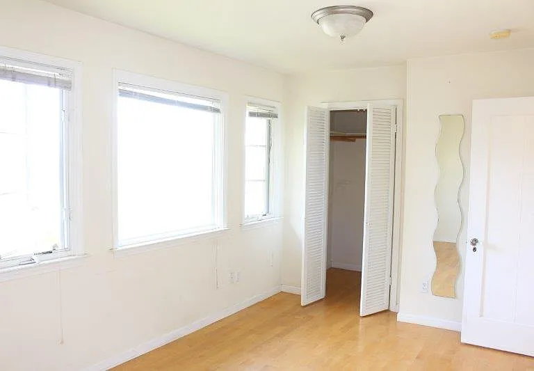 Bedroom with a walk-in closet.