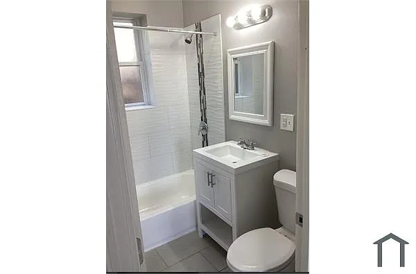 Building Photo - 1136 W 68th St #2