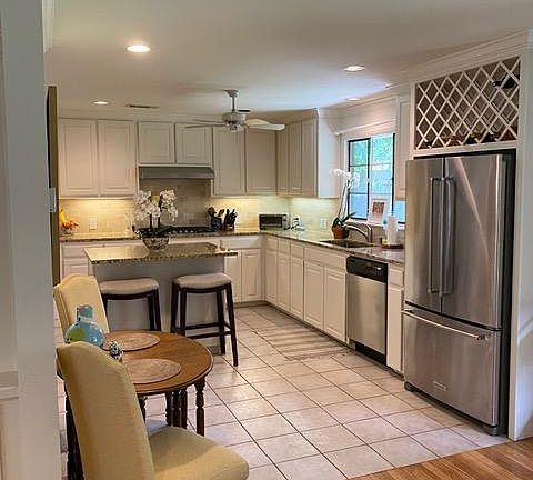 Granite countertops and KitchenAid refrigerator.
