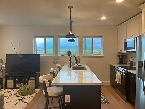 Kitchen with view and open to living room.