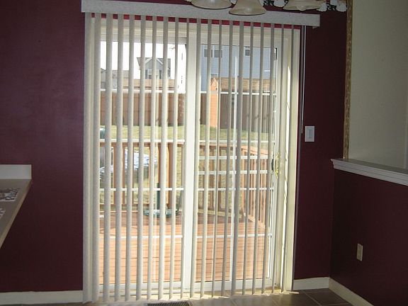 Glass sliding doors off kitchen to backyard