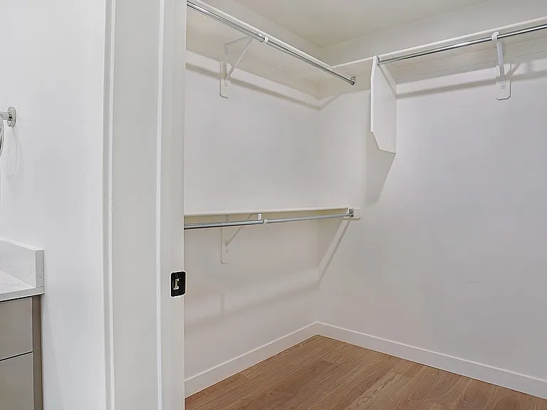 A walk-in closet designed for organized storage.