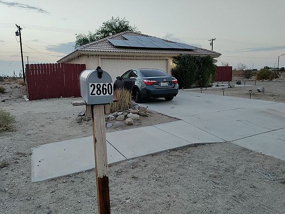 Front yard. 2 car garage. 