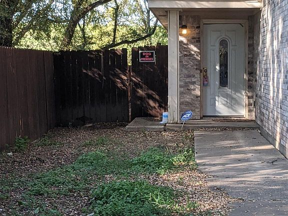 The yard is not too tidy in this photo, but it shows the great trees and what it looks like walking up to the front door