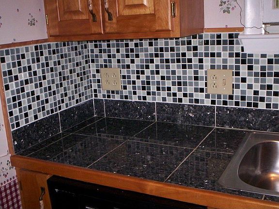 18 feet of custom cabinetry and granite counter tops and glass mosaic back spl