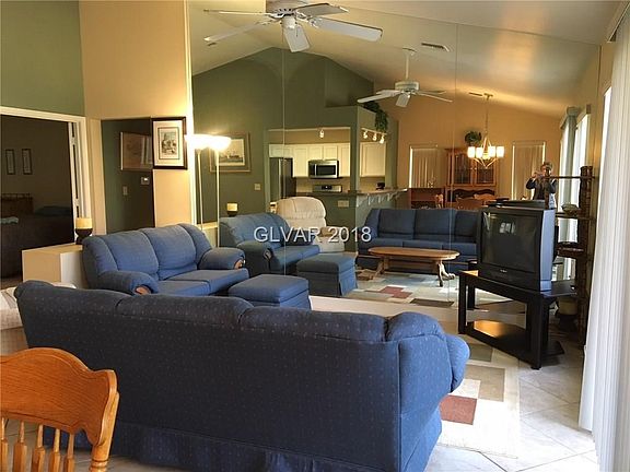 Living room w/ mirrored wall