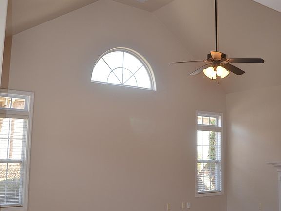 Living Room with 14 ft ceiling, fresh paint throughout