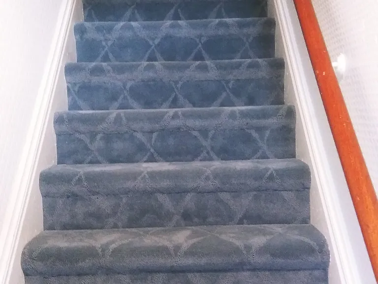 Private entrance with stairs directly up to the unit.