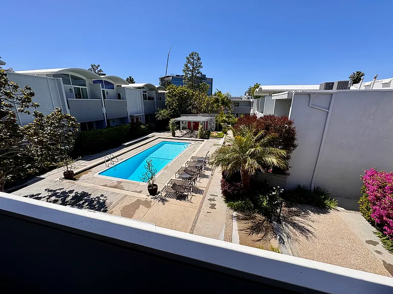 Pool View From Primary Bedroom Balcony