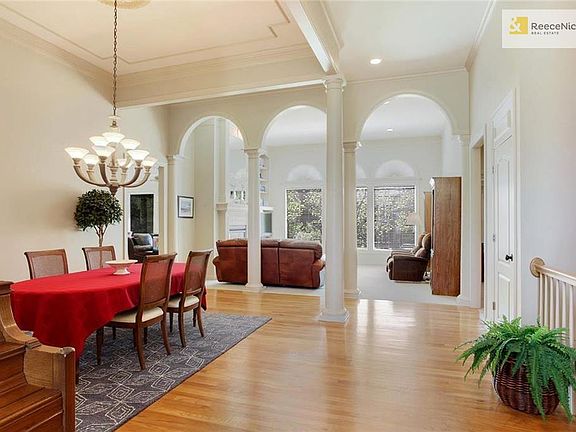From entry:  Open Concept Dining and Great Room, separated by distinguishing Columns.