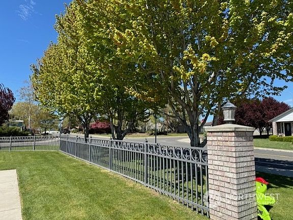 Beautiful fencing surrounds property.>