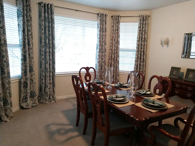Front room with bay window. Could be used as living room, dining room, sitting room.