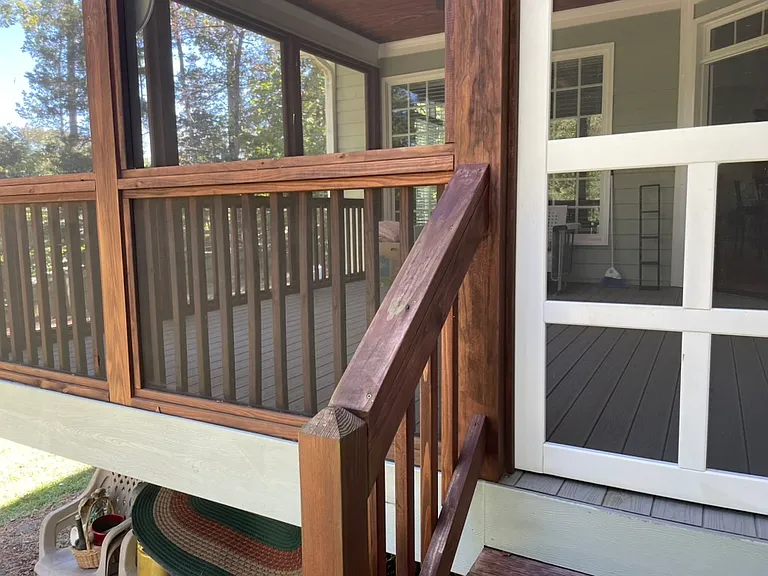 Stairs to screened porch from back yard