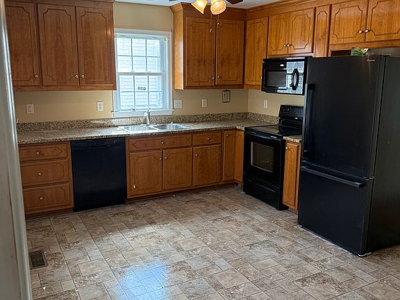 kitchen with dishwasher, range, otc microwave, refrigerator
