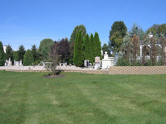 Impeccably designed Plantique rock waterfall, seashore rocks, cabana 