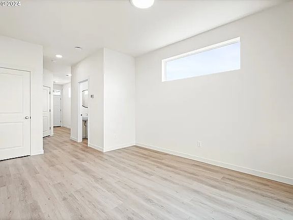 Dinning area with entry closet and 1/2 bath in background