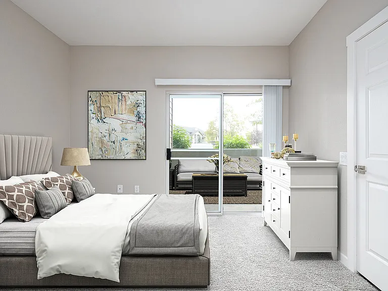 Experience serene living in this elegantly designed bedroom with access to a private patio.