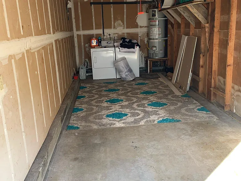 Garage with power opener and laundry hookups. Current tenant may sell their washer/dryer