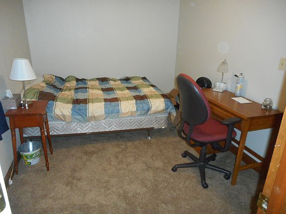 bedroom with full size bed and desk