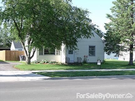 Front of Home
						:
						Tree in front blooms beautifully pink in spring. Flower beds in front also.