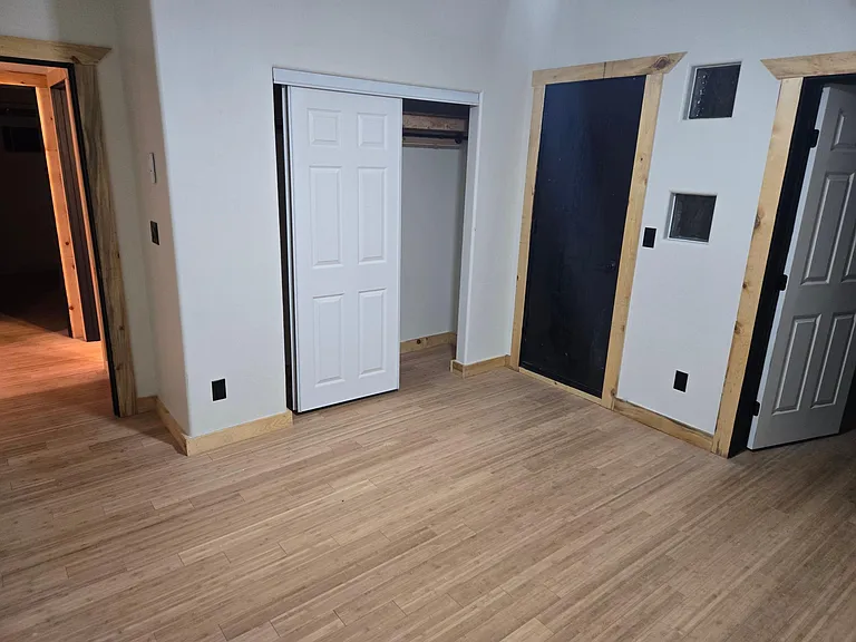 Master bedroom with closet and Deck door.