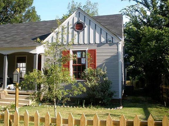 Front yard when building redone with small oak. Compare to now!