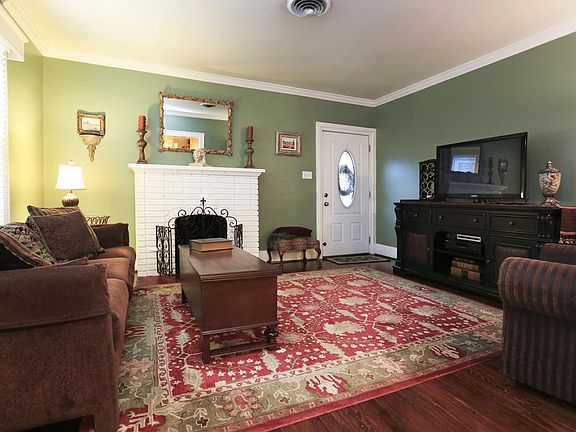 Gas Log Fireplace and original wood floors throughout home