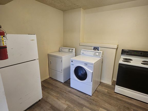 New washer and dryer, flooring, paint and cabinets in the kitchen