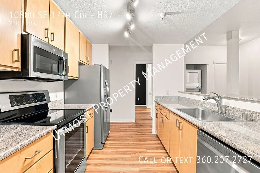 Experience effortless living in this beautifully maintained corner-unit 2BD 2BA condo — Photo 3