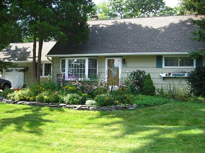 Beautifully Landscaped Expanded Cape Cod