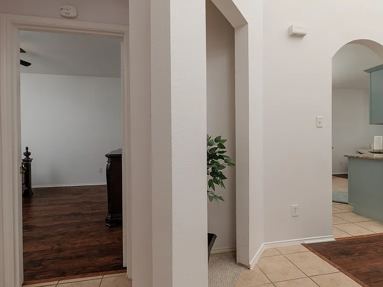 Hallway view to kitchen and primary bedroom.
