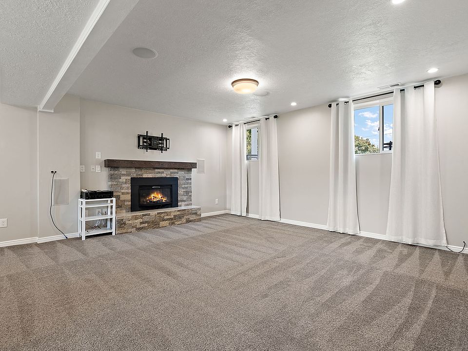 Living area with gas fireplace and surround sound.