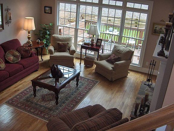 Relax or entertain in 2-story great room around stone fireplace