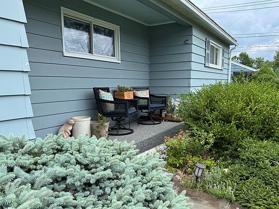 Front porch made private with evergreens