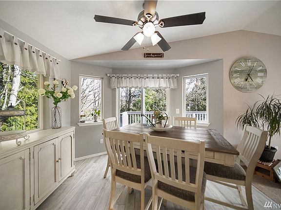 Light-filled dining room. Muted paint colors lend serenity to this space.