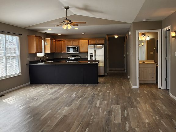 View - Living room and Kitchen - New vinyl plank flooring and fresh paint