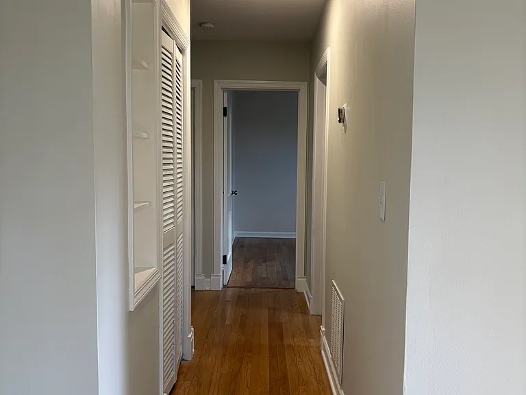 Hallway leading to bedroom 2 and 3 as well as full bathroom