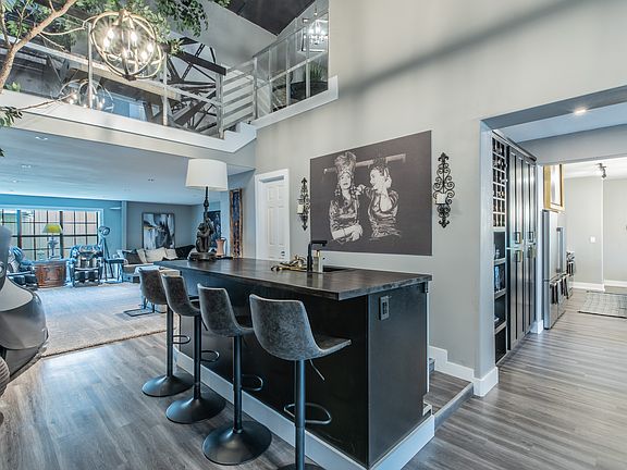 Sleek bar area with seating, perfect for morning coffee or evening drinks.