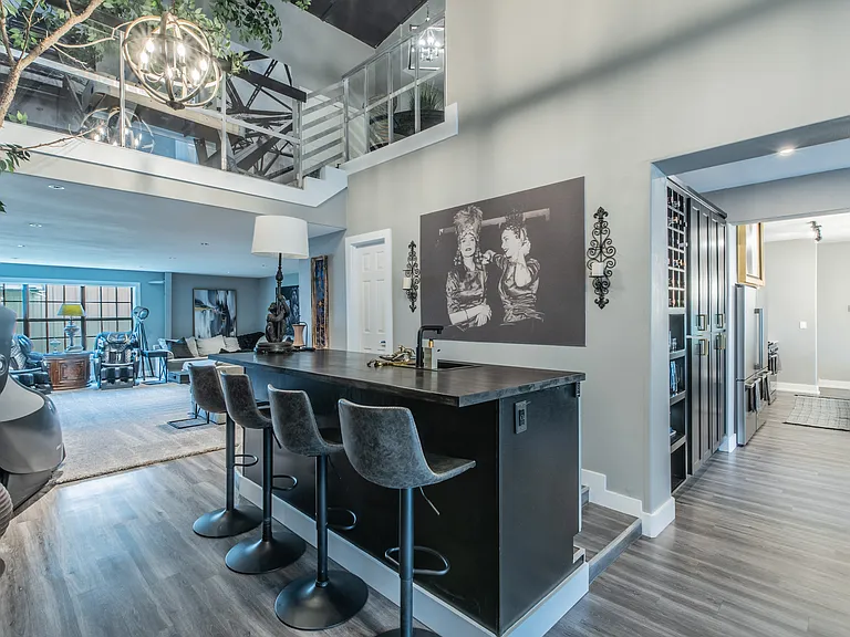 Sleek bar area with seating, perfect for morning coffee or evening drinks.