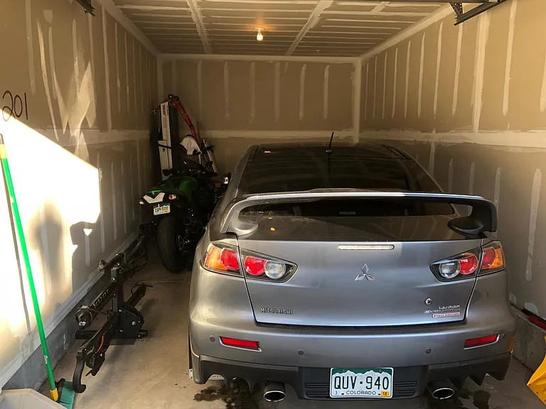 attached garage with car and bike