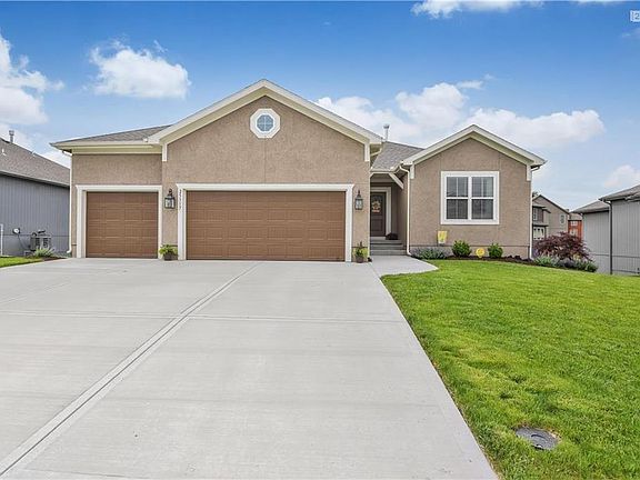 One of MANY extra features on this home include the driveway with all three bays having full length concrete from garage to street.Also, the home boasts fresh landscaping and the added sprinkler system by the owners helps keep this lawn looking great and low maintenance.