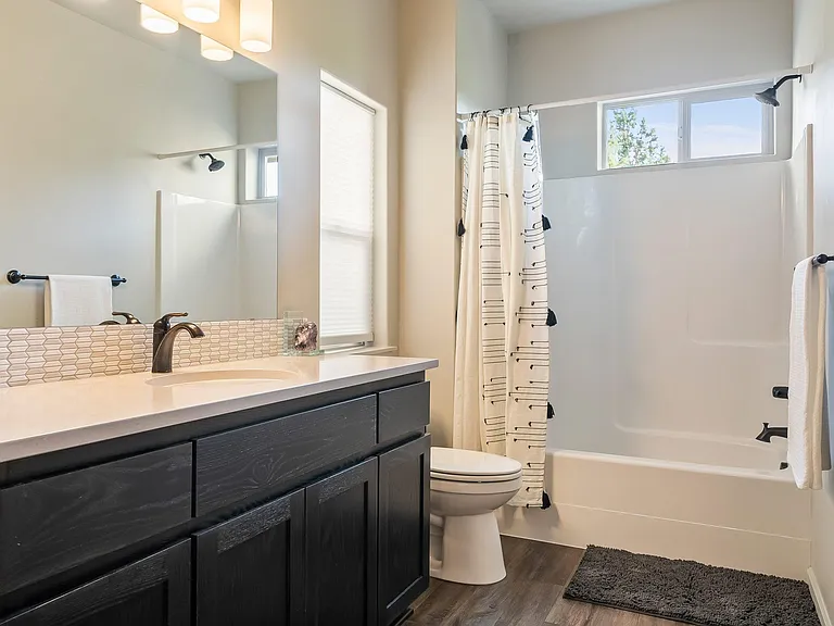 Downstairs bathroom with full tub.