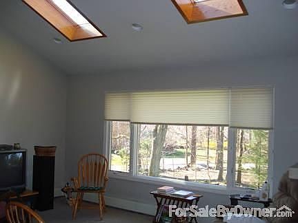 LIVING ROOM
						:
						14 FOOT CEILINGS WITH SKYLITES AND REMOTE RETRACTABLE SHADES