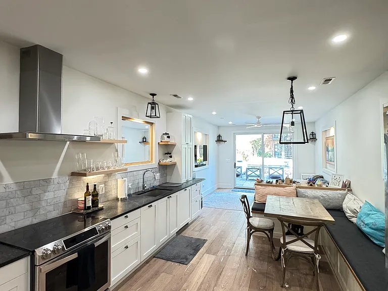 Kitchen, Dining, Family Room to the Rear Patio and Yard