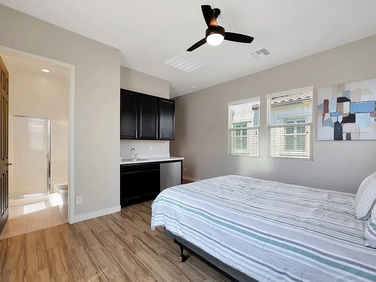Detached casita. Bedroom and full bathroom with mini-fridge and sink.