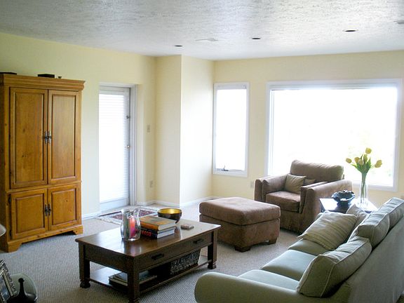 The airy living room is large and gets beautiful sun light. The picture doesn't do it justice! This is the view once you enter the unit to the right.