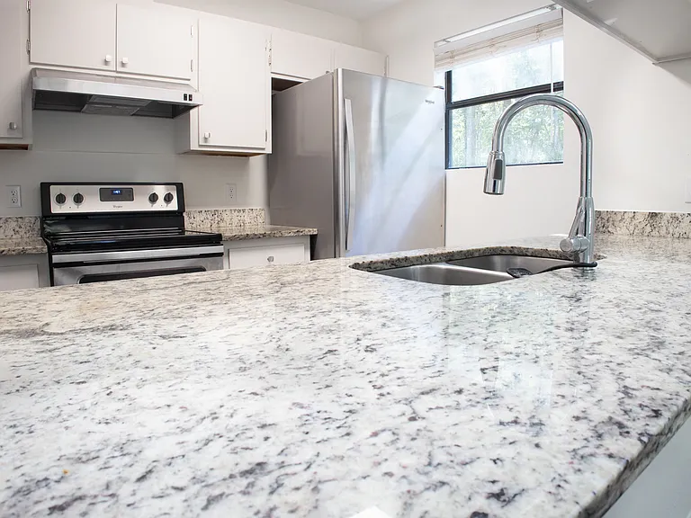 Granite countertops throughout the kitchen